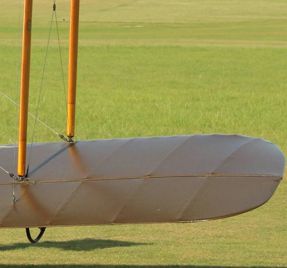 Vintage British biplane on a grass runway